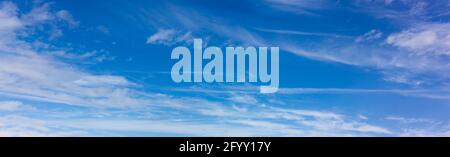 Panorama of blue sky with blurred white clouds. Abstraction of a cloudless clear sky Stock Photo