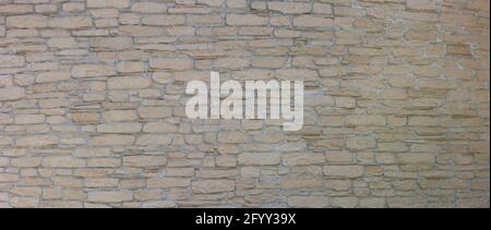 Pattern of decorative stone on the wall. House wall facade background. Stock Photo