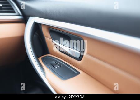 Car handle and window lifter button in luxury car Stock Photo