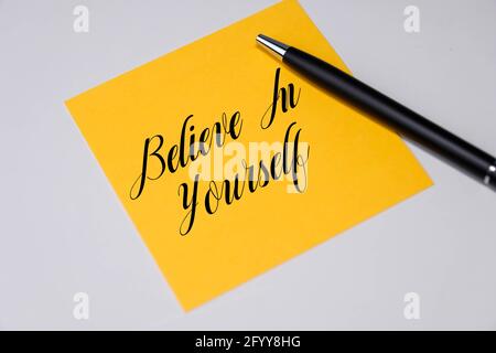 Believe in yourself words on a yellow sticky notes. Stock Photo