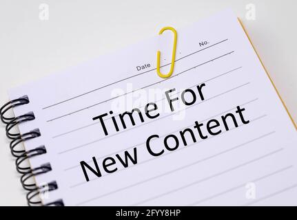 Time for new content words written in a notebook. Stock Photo