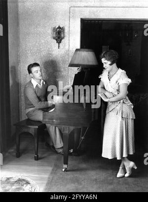 JAMES CAGNEY and his Wife BILLIE / FRANCES CAGNEY in the living room of their home July 1931 publicity for Warner Bros. Stock Photo