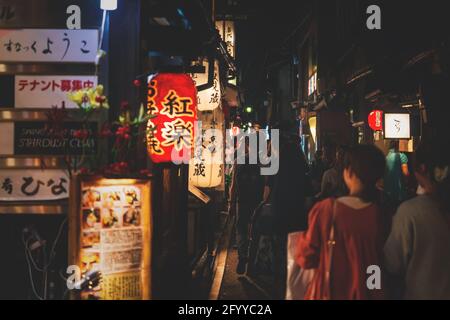 Kyoto, Japan - 17 September 2017: Tourists walking along illuminated restaurants and bars in Pontocho street at night in old town Stock Photo