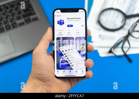 Kharkov, Ukraine - May 28, 2021: Man download Microsoft Teams app photo Stock Photo