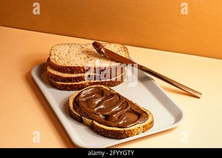 Chocolate cream sandwich on a tray on the table ready for breakfast Stock Photo