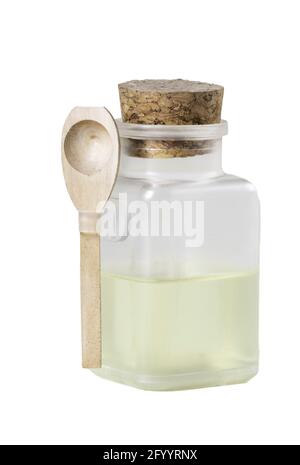Plastic container and oil with a wooden spoon. Accessories for storing syrups. Isolated background. Stock Photo