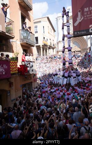 Tarragona, Spain, September 19, 2019 - Human Castells Tower on crowd of tourists