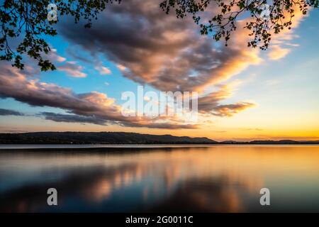 Colorful sunset on Lake Constance with colorful clouds Stock Photo