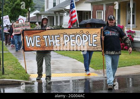 Bloomsburg, United States. 29th May, 2021. Members of We The People of Columbia County march during the rally.About 100 self-described patriots marched from Bloomsburg Town Park to Market Square for a pro-freedom rally during the Memorial Day weekend. (Photo by Paul Weaver/SOPA Images/Sipa USA) Credit: Sipa USA/Alamy Live News Stock Photo