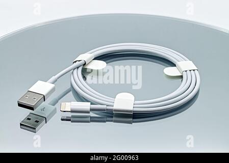 Bologna - Italy - May 15, 2021: Lightning to USB cable developed by Apple Inc. Stock Photo