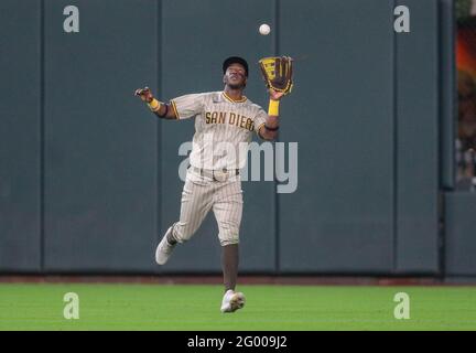 San Diego Padres' Jorge Mateo (3) puts the swag chain Jake Cronenworth (9)  after he hit a solo home run during the first inning of a baseball game  against the Los Angeles