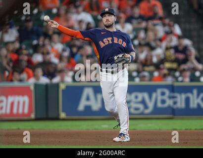 May 30, 2021: Astros first baseman Aledmys Díaz (16) makes a catch in foul  territory during MLB action between the San Diego Padres and the Houston  Astros at Minute Maid Park in