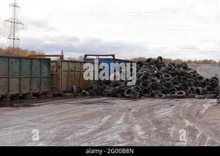 A big pile of tires in a landfill. Tires are specially selected from garbage for separate recycling. Stock Photo