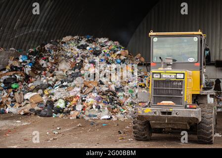 Moscow. Russia. October 2020. Garbage factory. Bulldozer near a large pile of garbage. Stock Photo