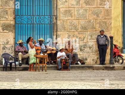 Havana, Cuba - February 2, 2010:  Street musicians play music for tourists in Havana, Cuba Feb 2, 2010.  Tourism is now Cuba’s main source of income a Stock Photo