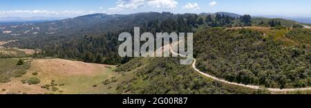 Trails meander through the vegetation-covered hills of the East Bay, just a few miles from San Francisco Bay in Northern California. Stock Photo