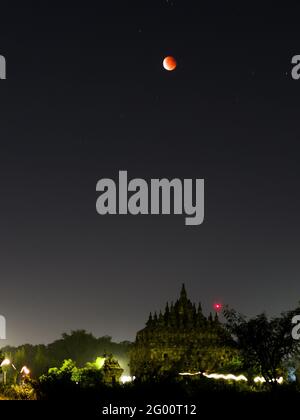 Super Blood Moon and Lunar Eclipse 2021 seen from the Plaosan Temple on May 26, 2021 in Central Java Province, Indonesia Stock Photo