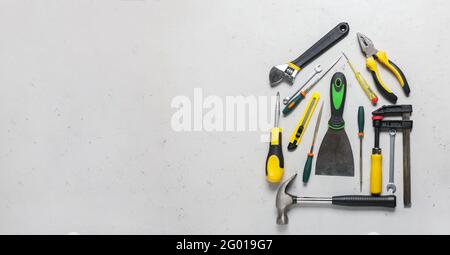 House shape made with construction tools on light background with space for text Stock Photo