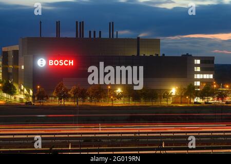 Dresden, Germany. 28th May, 2021. Cars pass in the evening on highway 4 in front of the new semiconductor factory of Bosch (shot with long time exposure). The plant will go into operation on 07.06.2021. Credit: Robert Michael/dpa-Zentralbild/dpa/Alamy Live News Stock Photo
