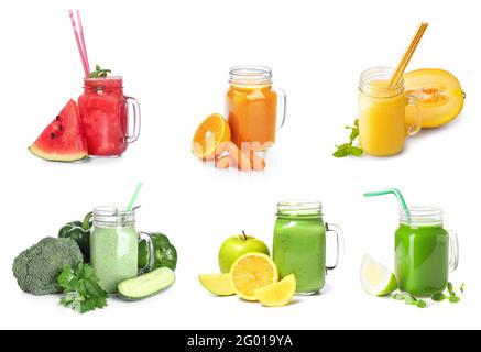 Mason jars of different healthy juices on white background Stock Photo