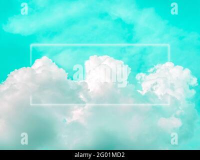 Blank rectangle white glowing light frame on dreamy fluffy cloud with aesthetic green neon sky background. Abstract minimal natural luxury background Stock Photo