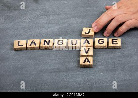 Riga, Latvia - May 10 ,2021: JAVA code and programming language concept. Wooden alphabet letters on a black chalk board Stock Photo