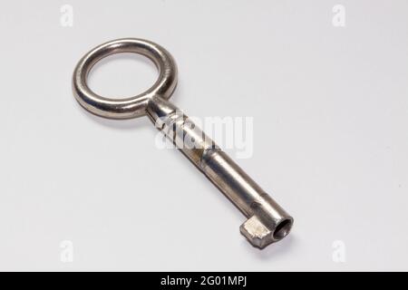 Vintage metal key isolated on a white background Stock Photo