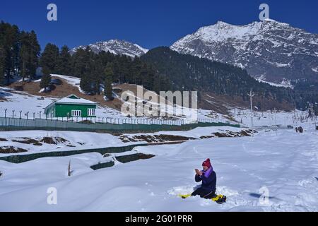 Muslim Man offering afternoon Namaz during the harsh winter time of Chilla Kalan in Kashmir. Image shot at Aru near Pahalgam, Kashmir Stock Photo