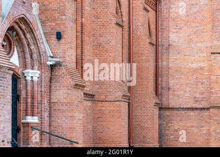 Fragment red brick wall catholic church nice background. Stock Photo