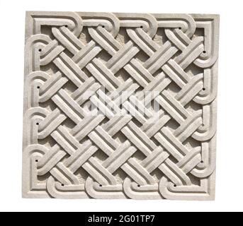 Square braided stone ornament. Old stone wall detail with decorative pattern. Isolated on white background Stock Photo