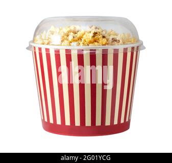 Paper striped bucket with popcorn isolated on white background . Concept of cinema or watching TV. Stock Photo