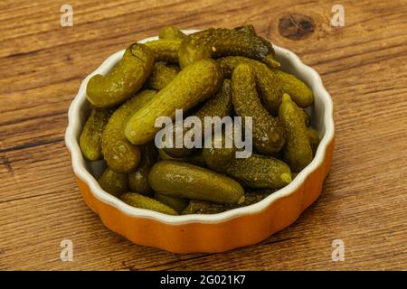 Pickled young gherkin in the bowl Stock Photo