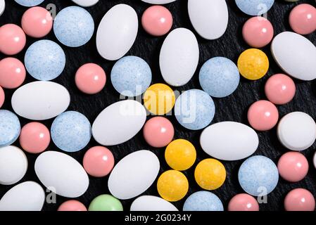 Various medicines. Pills, tablets on black background. Pharmaceutical drugs and medications, top view Stock Photo