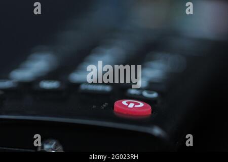 Close up red power button of TV remote control Stock Photo