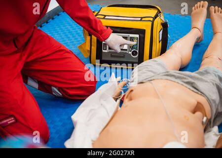 First aid cardiopulmonary resuscitation course using automated external defibrillator device, AED. Stock Photo