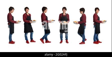 same woman with various poses holding a pile of dirty plates with food on white background Stock Photo