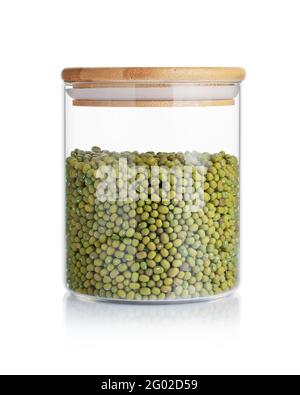 Dry mung beans in a glass jar isolated on a white background. Stock Photo