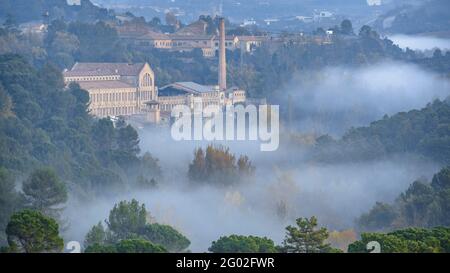 Autumn foggy sunrise in the textile colony (company town) of Cal Vidal (Berguedà, Catalonia, Spain) Stock Photo