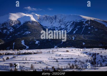 Cambredase peak snowy viewed from Mont-Louis village in a winter afternoon (Pyrenees Orientales, Occitanie, France) Stock Photo