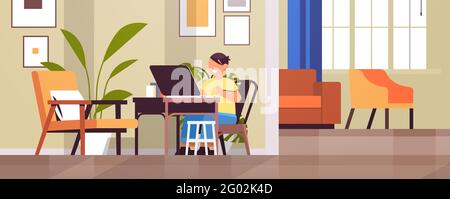 schoolboy at workplace using laptop little boy doing homework education concept living room interior Stock Vector