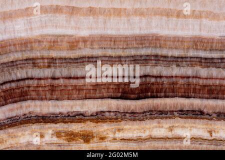 Excellent Rainbow Onyx background, texture in your admirable brown tone for new interior look. Stock Photo
