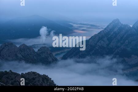 Serra de Bastets seen from the Lord Sanctuary in a foggy morning (Solsonès, Catalonia, Spain, Pyrenees) Stock Photo