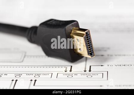 HDMI connector on the background of the video signal connection diagram. Stock Photo
