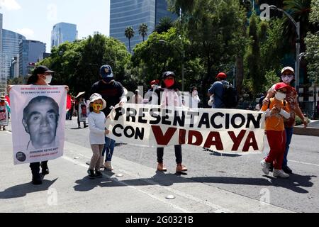 Mexico City, Mexico. 30th May, 2021. Relatives take part during a march at Reforma Avenue as part of the International Week of the Disappeared persons in Mexico, relatives protest against the inaction and indifference of the governments to solve their cases on May 30, 2021 in Mexico City, Mexico. (Photo by Eyepix/Sipa USA) Credit: Sipa USA/Alamy Live News Stock Photo