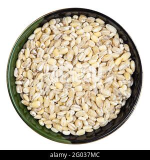top view of pearled barley grains in round bowl isolated on white background Stock Photo