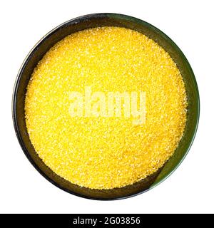 top view of polenta cornmeal in round bowl isolated on white background Stock Photo