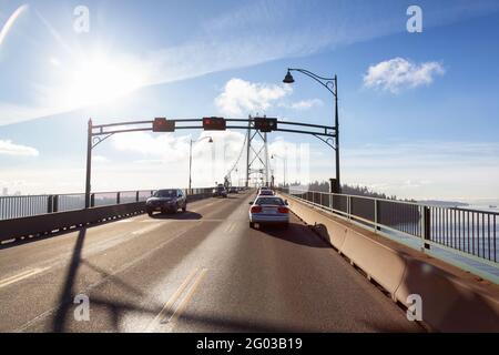 Drive across the famous Lions Gate Bridge in the modern Downtown City. Stock Photo