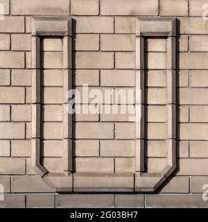 Large letter U composed of light clinker Stock Photo