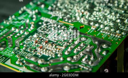 Electronic printed circuit board with soldered contacts on the reverse side of the parts Stock Photo