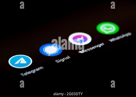 31-05-2021 Hamburg, Germany: close-up view of app icons of different messaging apps on smartphone display, Telegram, Signal, Facebook Messenger and Stock Photo